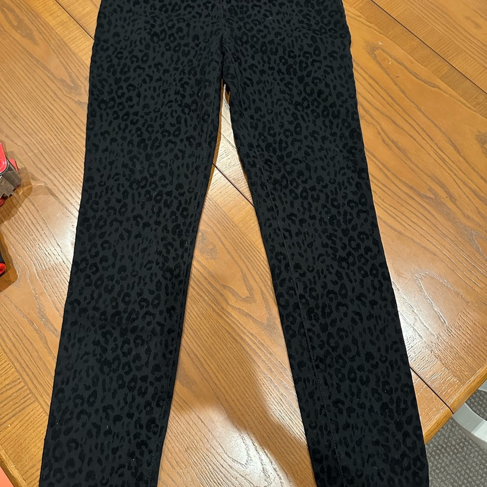 INC pull on black on black flocked cheetah print jeans.  Reg womens size 8. EUC